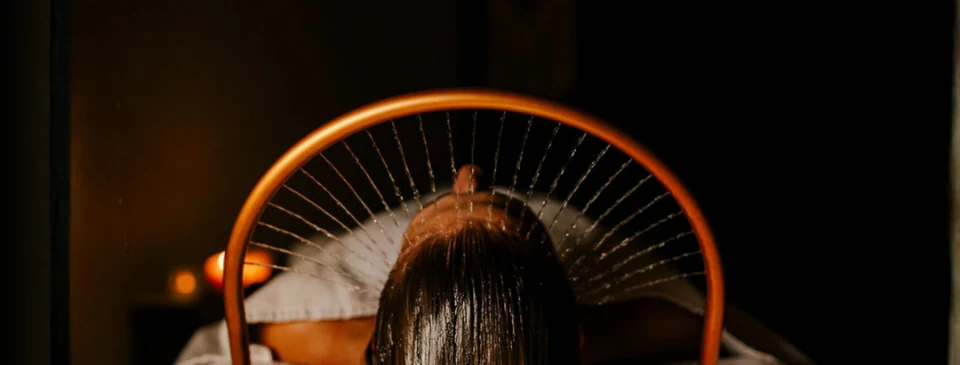 Head spa treatment with gentle water stream over the scalp